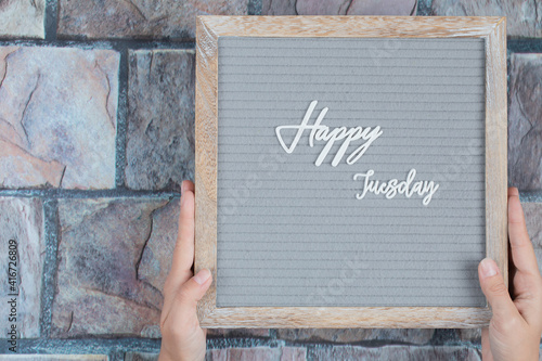 Happy tuesday phrase embedded on grey background