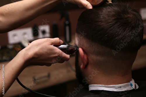 hair cutting for a man in a salon