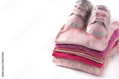 Baby rompers and baby shoes isolated on white background. Top vioew. Copy space photo