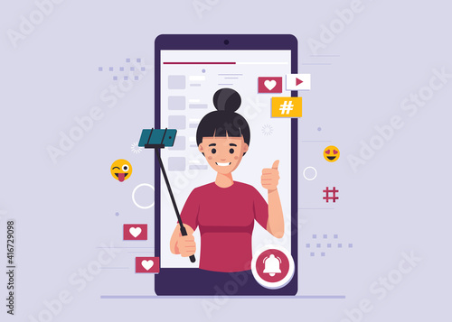 Woman takes a selfie. Female blogger, online blogging