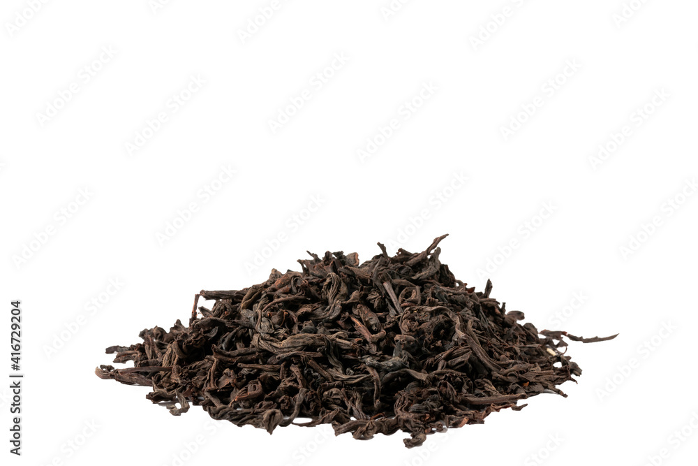 Dried tea leaves lying on the table in a slide Dried tea leaves lying on the table in a slide
