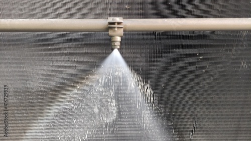 Cooling system for industrial heat exchangers. Industrial fan cooling tower.  Cooling Tower of Power Plant. Cooling tower adiabatic cooling system. Metal industrial air cooling system vent. 