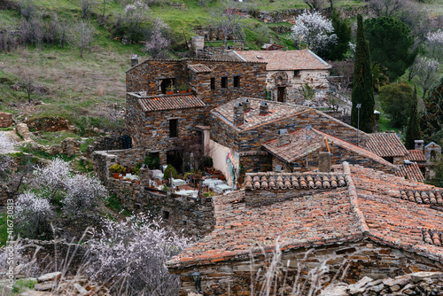 View of the antique and touristic village of Patones de Arriba, Madrid, Spain. Cozy restaurant. Slate stone architecture photo