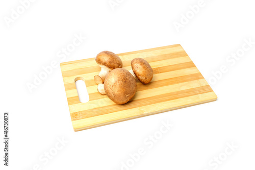royal champignons on cutting board isolated on white