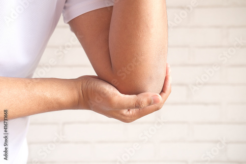 man with elbow pain, Pain relief concept.