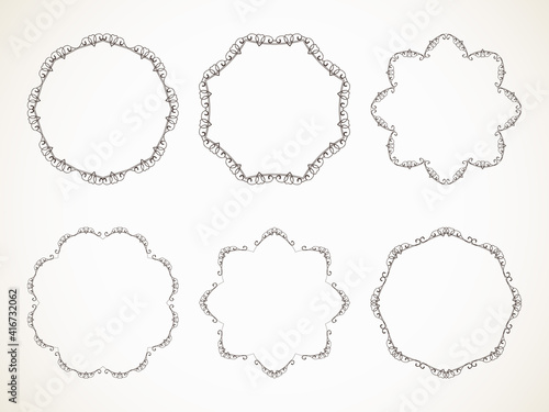 Ornamental calligraphic round frame with heart design element, Vector set