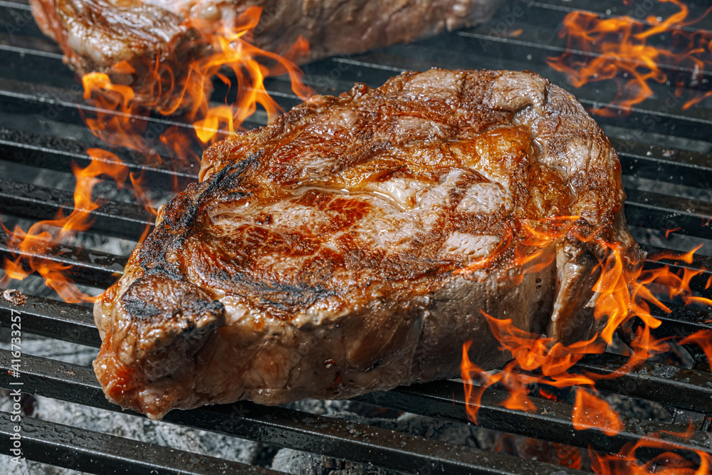 barbeque steak on a black slate board