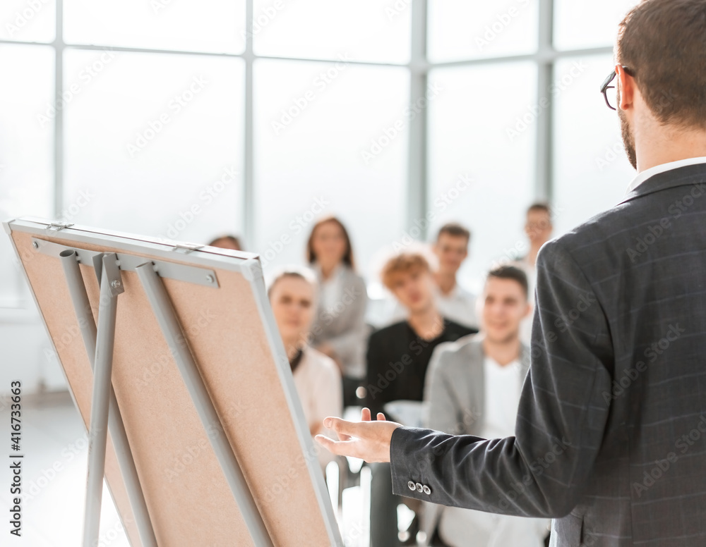 speaker is pointing at a flip chart during your presentation.