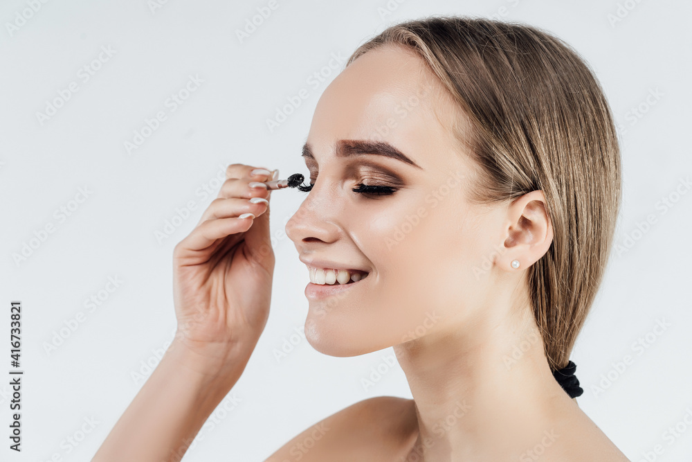 Eyelash care. Beautiful female look with beautiful eyelashes. Beauty and freshness, beauty salon and eyelash extension master Eyelash care. Beautiful female look with beautiful eyelashes. Beauty and freshness, beauty salon and eyelash extension master