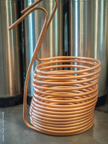 A copper immersion heat exchanger for use in the craft beer process. Selective focus. Home brewing process