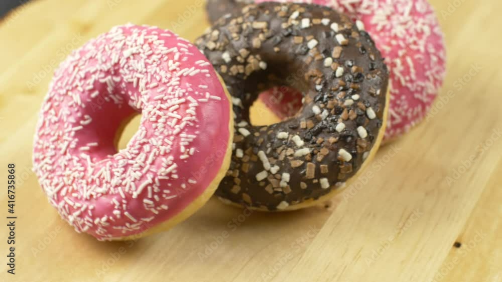 a group of delicious colored donuts a group of delicious colored donuts