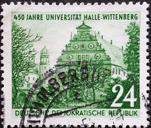 GERMANY, DDR - CIRCA 1952 : a postage stamp from Germany, GDR showing the Augusteum in Wittenberg. 450 years of the University of Halle-Wittenberg photo