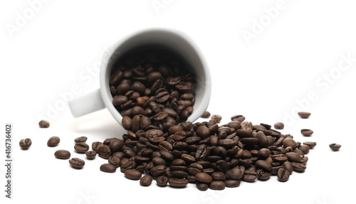 Coffee beans pile with white porcelain cup  mug isolated on white background