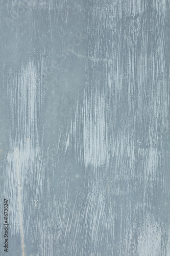Background with different shades of gray. Old metal surface with traces of the brush covered with gray or grey paint. 
