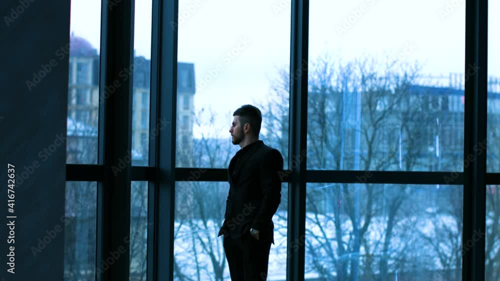 a brutal charismatic guy in a black suit a brutal charismatic guy in a black suit