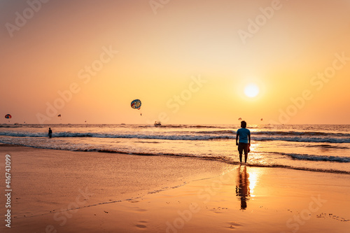 Man standing near beach shore alone