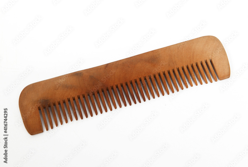 A comb is a tool consisting of a shaft that holds a row of teeth for pulling through the hair to clean, untangle, or style it. A comb is a tool consisting of a shaft that holds a row of teeth for pulling through the hair to clean, untangle, or style it.