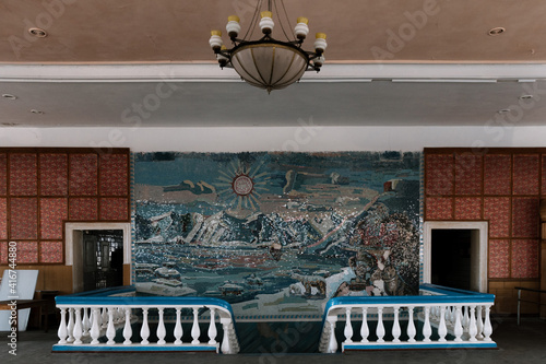 Cantina with soviet wall mural in the Ghost Town of Pyramiden, Svalbard