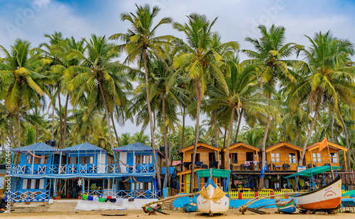 Colorful bungalows on the tropical beach of Palolem, beachfront resort photo