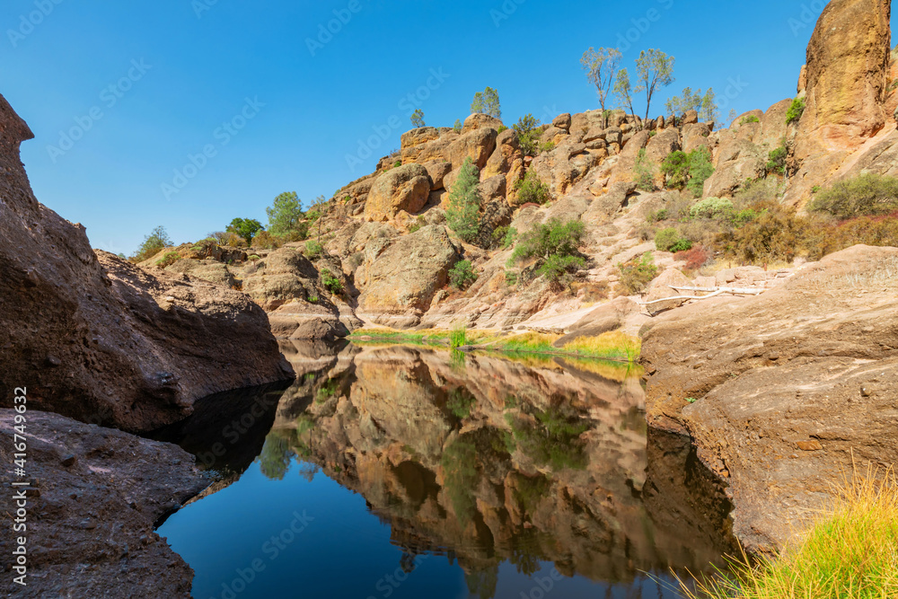 Lake Bear Gulch and rock formations in Pinnacles National Park in California, the ruined remains of an extinct volcano on the San Andreas Fault. Beautiful landscapes