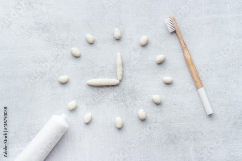 Bamboo toothbrush with toothpaste, overhead view.Dental hygiene concept