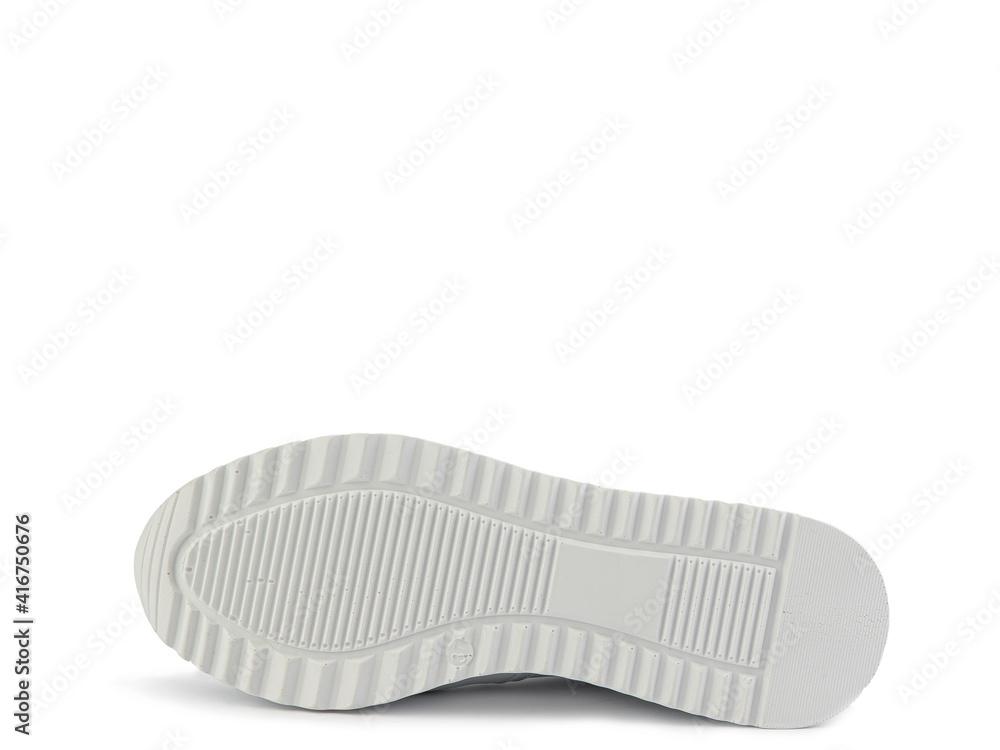 White classic leather trainers. Casual women's style. White lacing and white rubber soles. Isolated close-up on white background. Shoe sole view. Fashion shoes. White classic leather trainers. Casual women's style. White lacing and white rubber soles. Isolated close-up on white background. Shoe sole view. Fashion shoes.