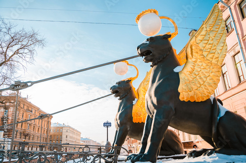 Lions with golden wings in St. Petersburg in winter, sights of the city. St Petersburg, Russia - 25 Feb 2021: