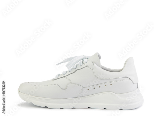 White classic leather trainers. Breathable, comfortable leather. Casual women's style. White lacing and white rubber soles. Isolated close-up on white background. Left side view. Fashion shoes.