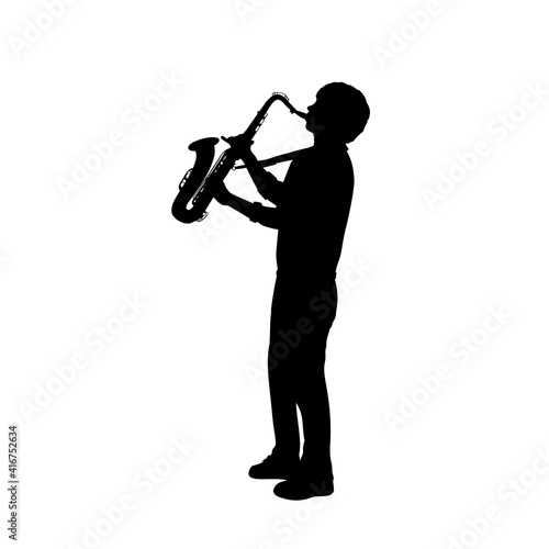 Silhouette boy music playing the saxophone.