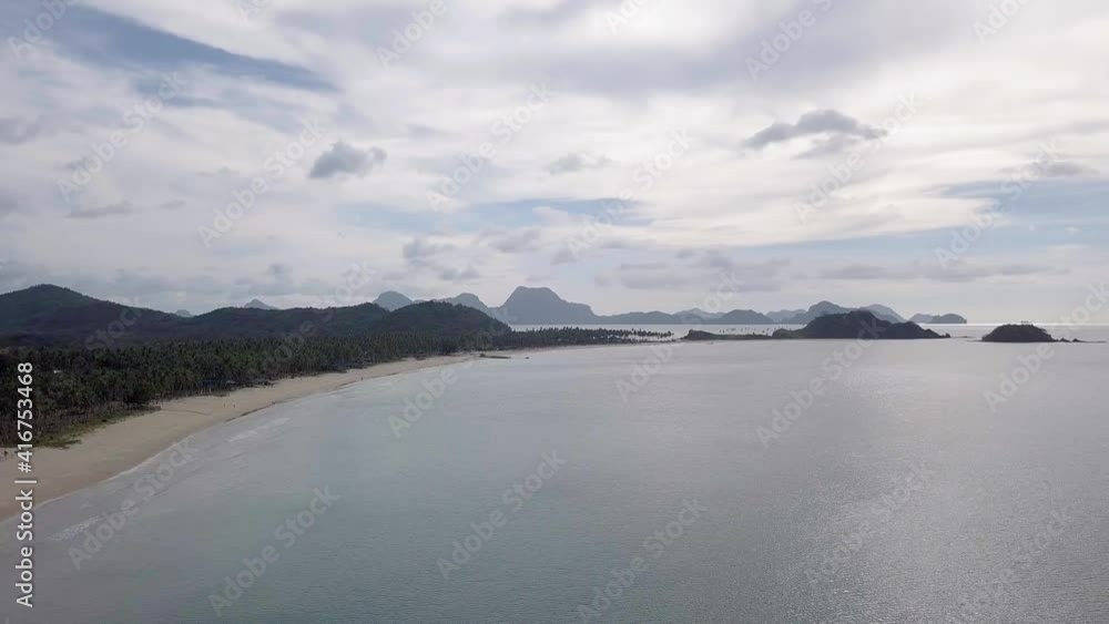4K Aerial Drone View of White Sandy Beach on a Tropical Island Nacpan Beach in El Nido, Palawan, Philippines 4K Aerial Drone View of White Sandy Beach on a Tropical Island Nacpan Beach in El Nido, Palawan, Philippines