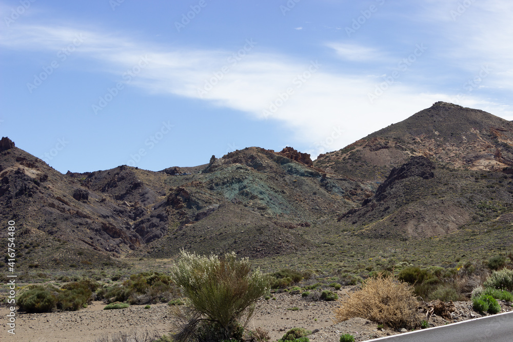 Mountain on Tenerife Island under a blue sky with desolated foreground
