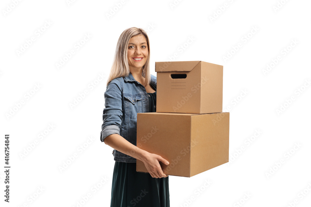 Young cheerful woman carrying two cardboard boxes Young cheerful woman carrying two cardboard boxes
