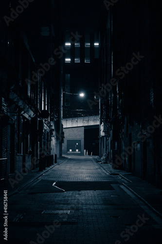 Moody monochrome shot of a dark alley