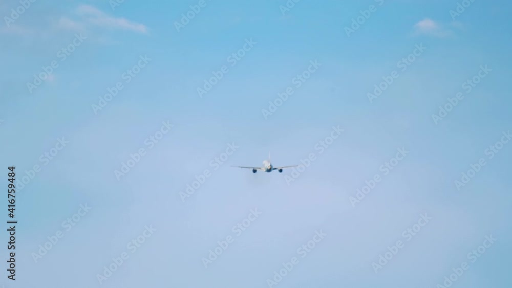 Airliner flies off into the distance Airliner flies off into the distance