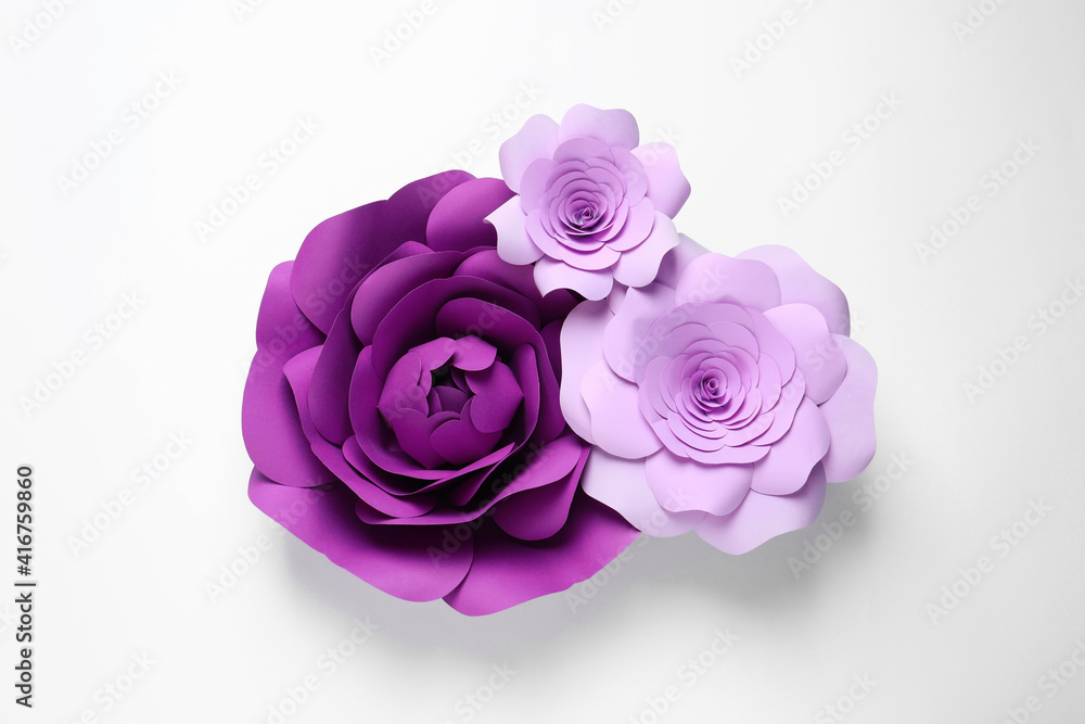 Different beautiful flowers of paper on white background, top view