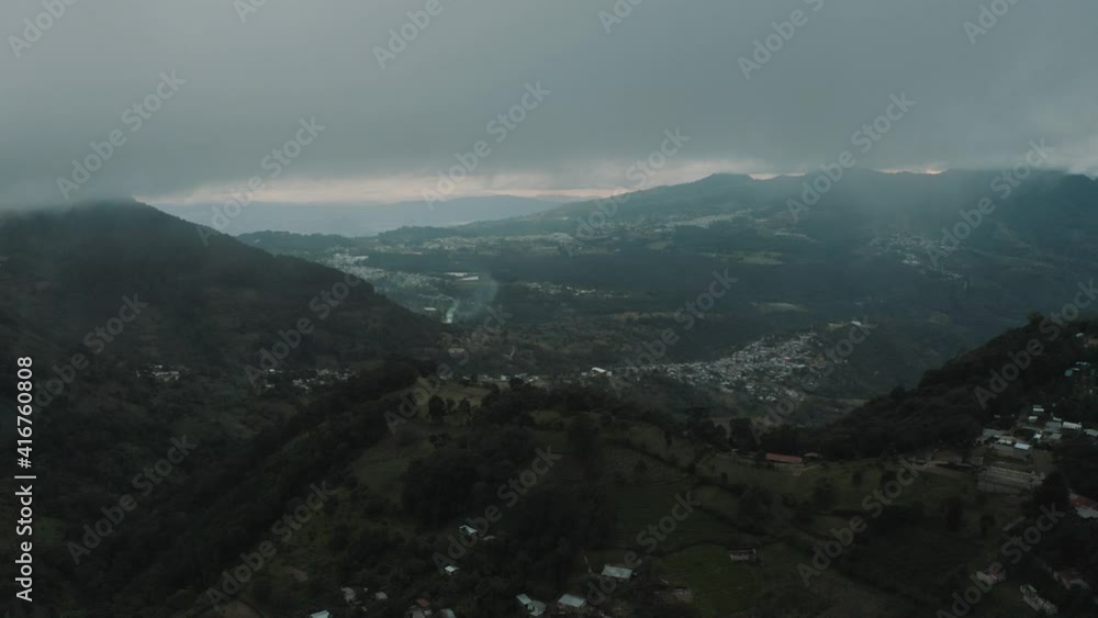 High up in the mountains during a cloudy windy day - Drone aerial landscape view High up in the mountains during a cloudy windy day - Drone aerial landscape view