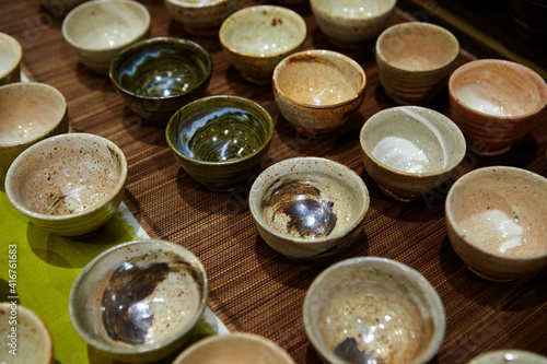 Various porcelain tea cups on the table