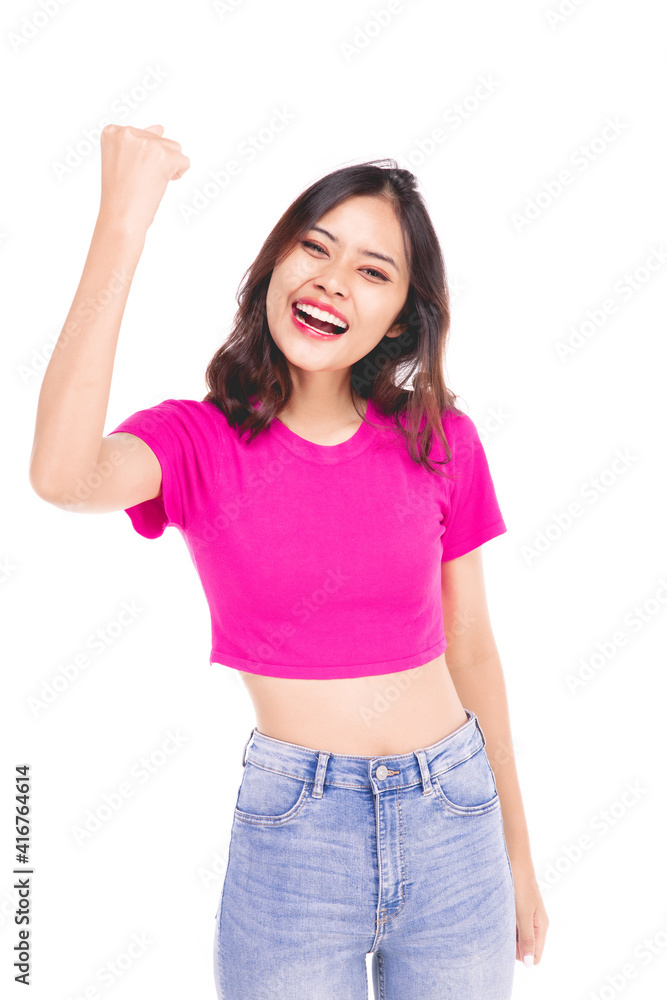Portraits of young Asian women. Raise arms. With a smiling face happily, a beautiful woman with a sense of self-confidence, looks good, happy on a gray background. Portraits of young Asian women. Raise arms. With a smiling face happily, a beautiful woman with a sense of self-confidence, looks good, happy on a gray background.