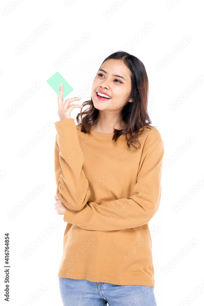Portrait of a beautiful woman Asian teenagers Showing my credit card With a confident, happy face, a confident, beautiful woman on a white background. Portrait of a beautiful woman Asian teenagers Showing my credit card With a confident, happy face, a confident, beautiful woman on a white background.