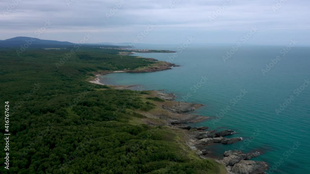 Drone flight above a picturesque rocky coastline with small wild beaches and green forests on the southern coast of the Black Sea, Bulgaria Drone flight above a picturesque rocky coastline with small wild beaches and green forests on the southern coast of the Black Sea, Bulgaria