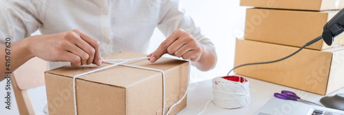 Shipment Online Sales, Small business or SME entrepreneur owner delivery service and working packing box, business owner working checking order to confirm before sending customer in post office