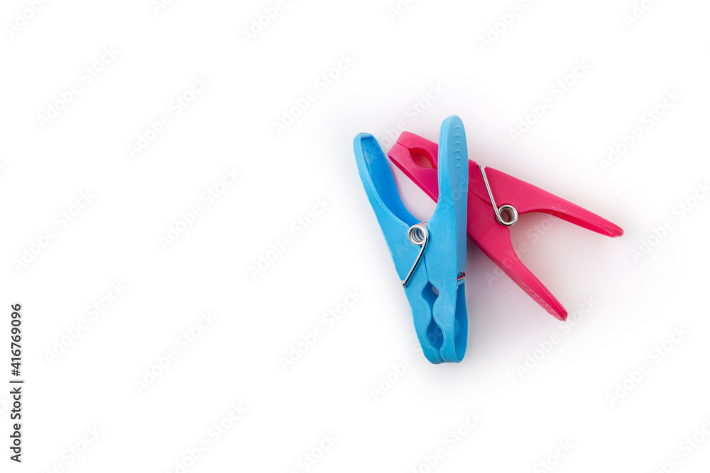 top view of two different color clothespins isolated on white background top view of two different color clothespins isolated on white background