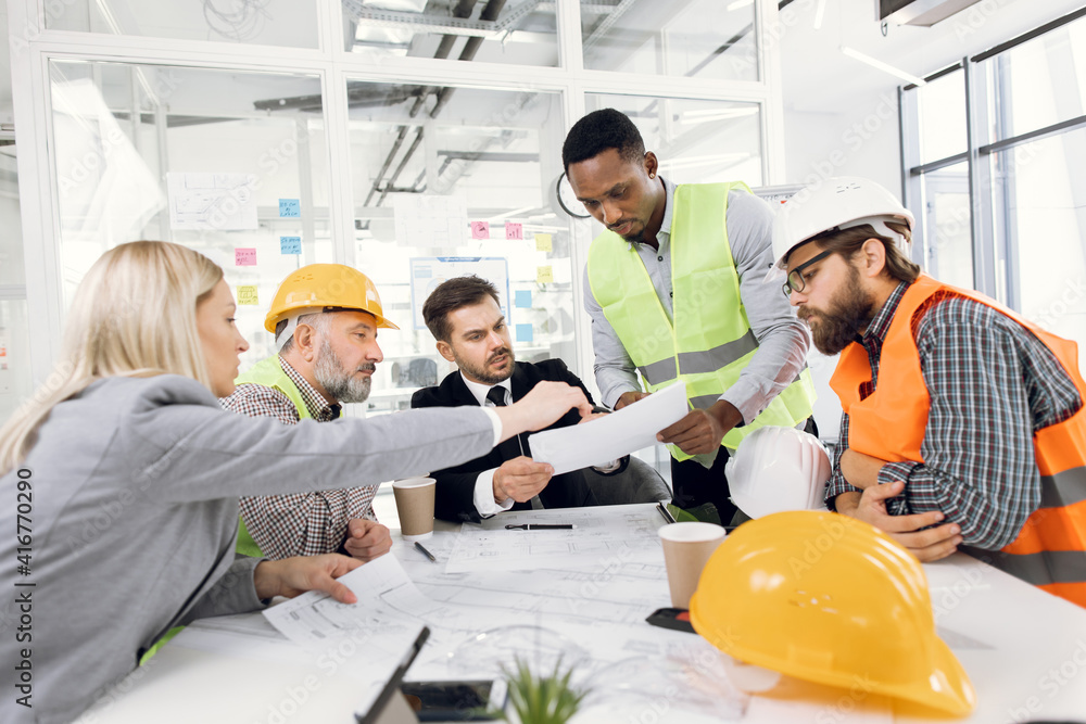Multiracial people brainstorming for common architecture project