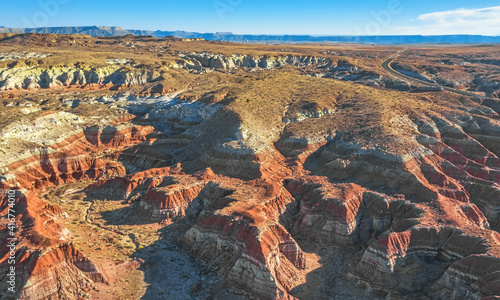 Aerial view from drone of a beautiful rise of red and orange rock formations due to erosion on the Toadstool Trail in Kanabe, Utah.