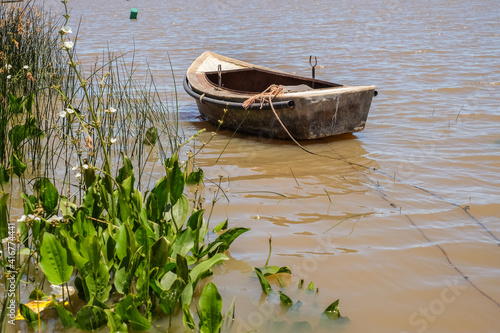 Small leisure boat used by local fisherman at Juan Lacaze's harbour, Colonia, Urugua photo