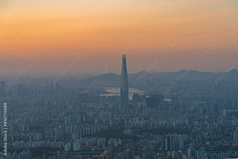 Orange sunset over Seoul city in South Korea.