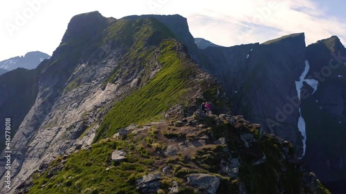 Flying around mount Reinebringen with tourists in the Lofoten Islands, Norway