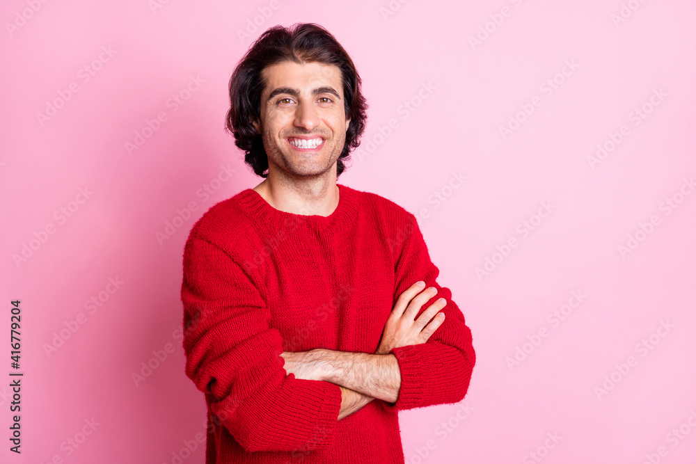 Obraz premium Photo of young handsome smiling happy good mood positive man with folded hands isolated on pink color background
