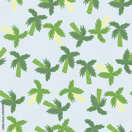 Simple random botanic seamless pattern with green hand drawn palm tree shapes. Blue light background.