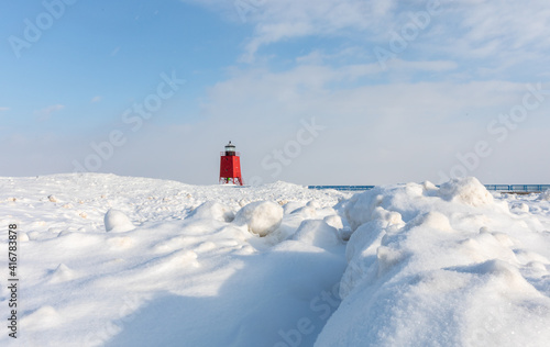 The red Charlevoix lighthouse in winter